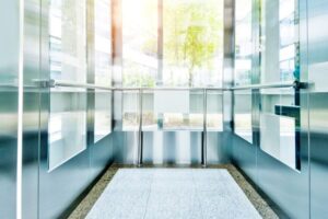 Is there a protective measure for the elevator bottom and the top of the lift?